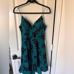 Blue dress with black flowers and rind stones